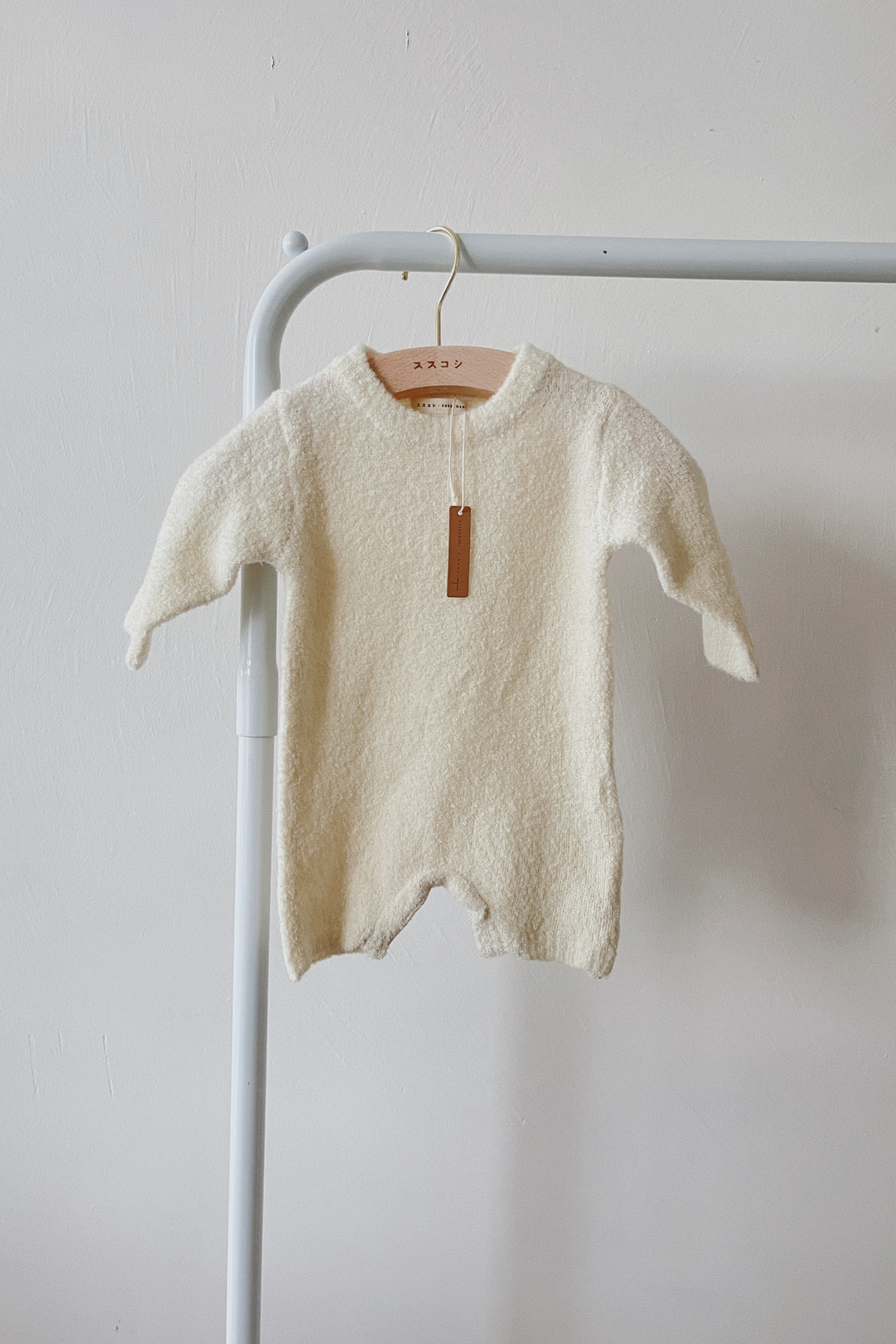 Boucle Knit Baby Romper. Milk
